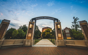 A photo of the Purdue Gateway with a blue sky