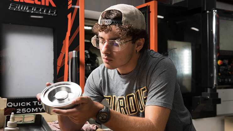 Purdue student working in a lab.