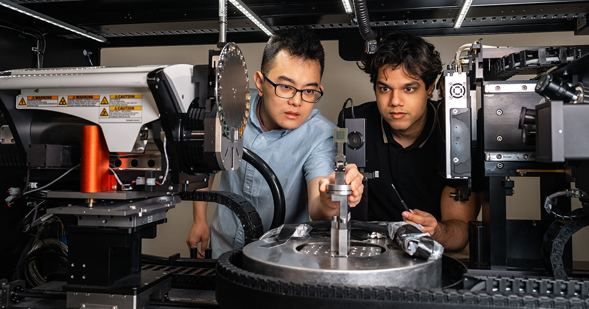 Material engineering students work together on semiconductor chips