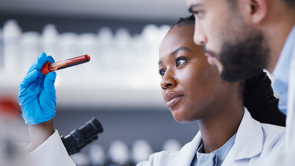 Colleagues work together in a science lab
