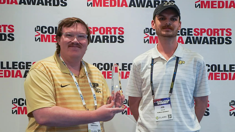 McCarty Cummings and Joe Wallpe accept the College Sports Media Award for Best Non-Event Live Broadcast.