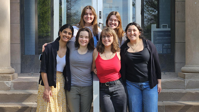 English Ambassadors stand together in front of Stanley Coulter Hall