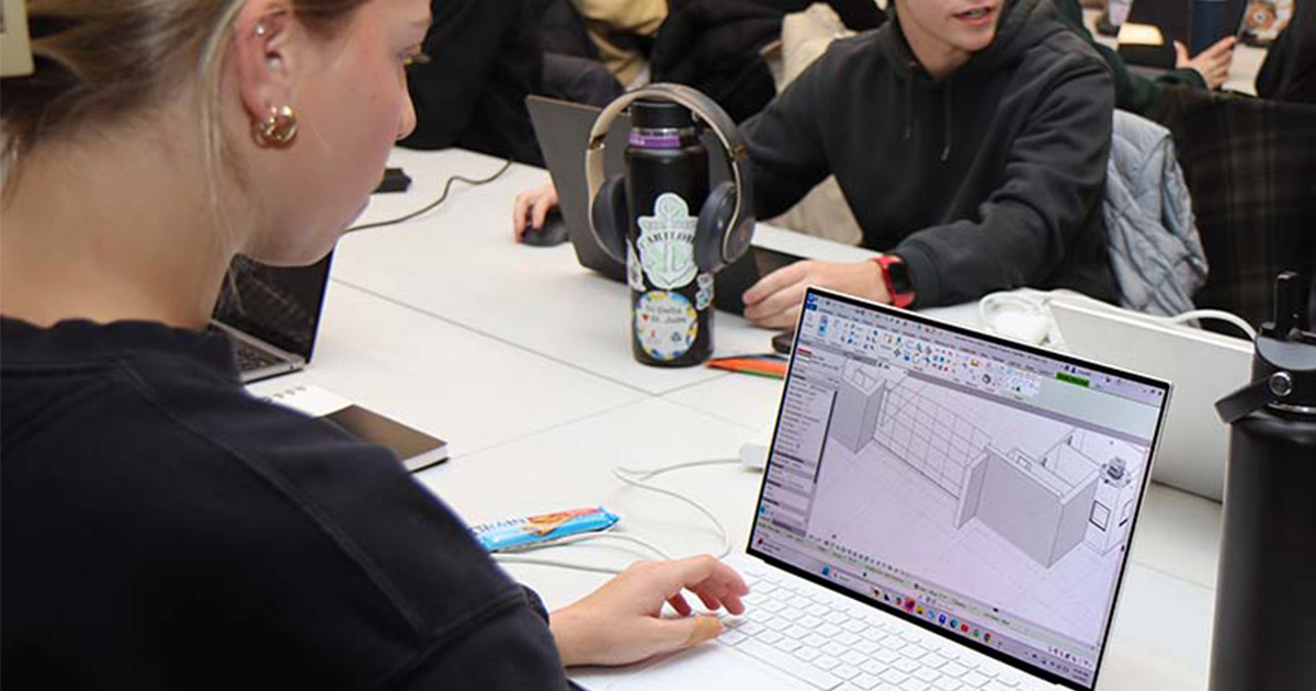 girl on computer using CAD program