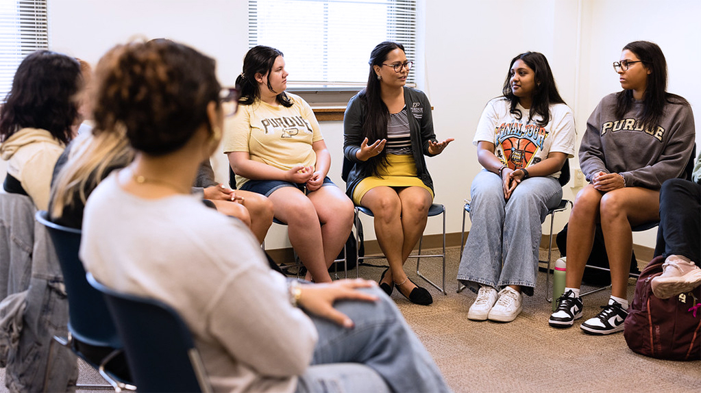 An instructor leads a discussion in a supportive setting