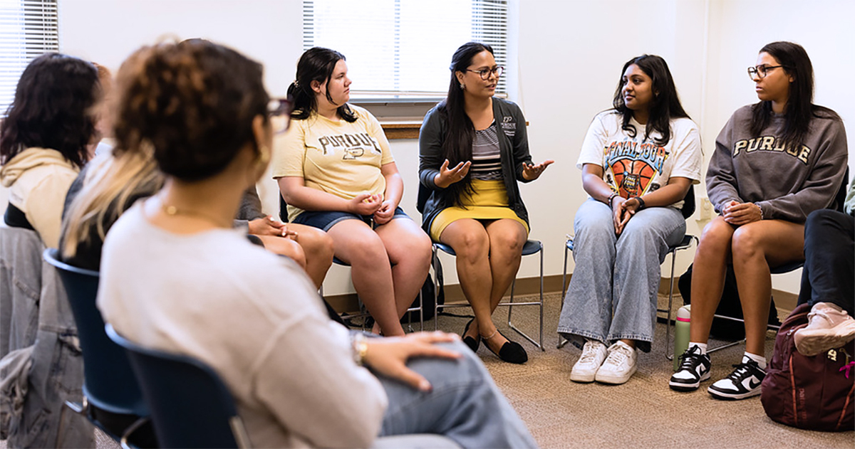 An instructor leads a discussion in a supportive setting