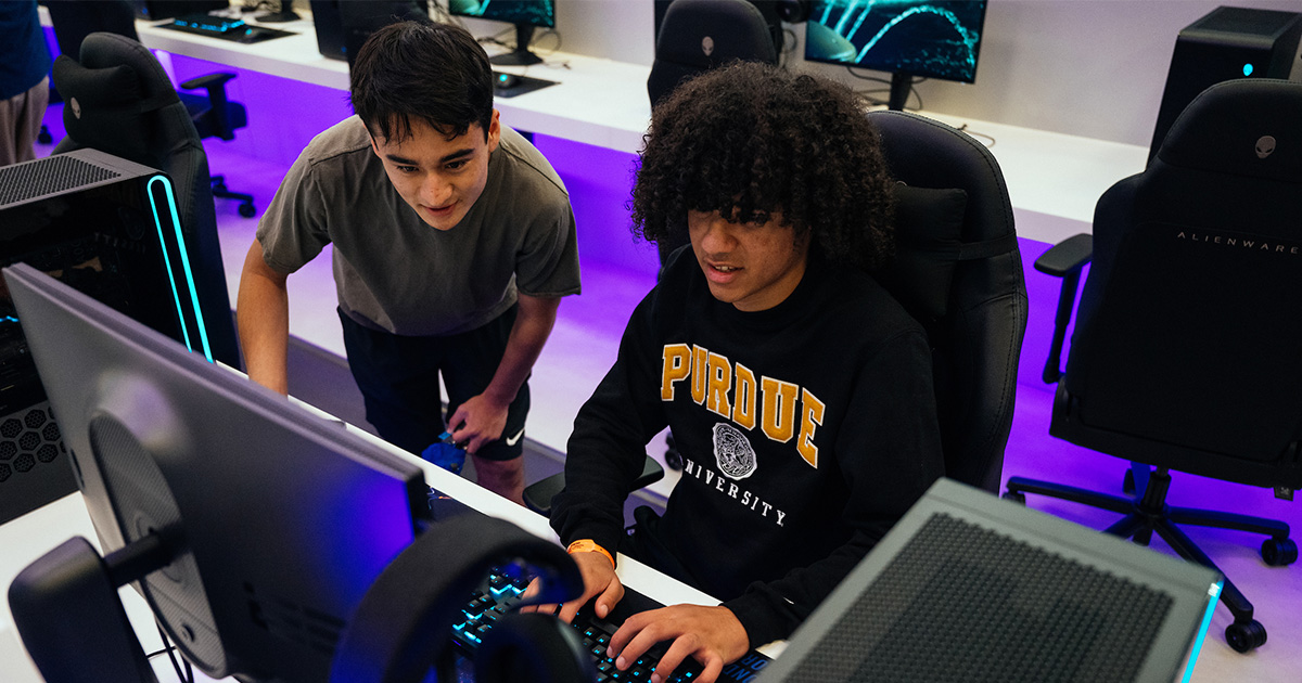 two students in gaming lounge looking at computer