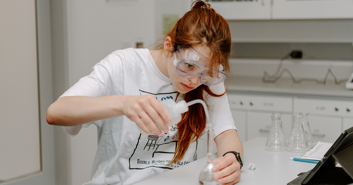 student in lab executing research activities