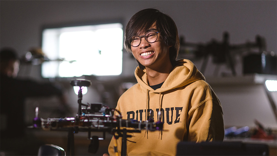 Hudson Tsang smiling in lab