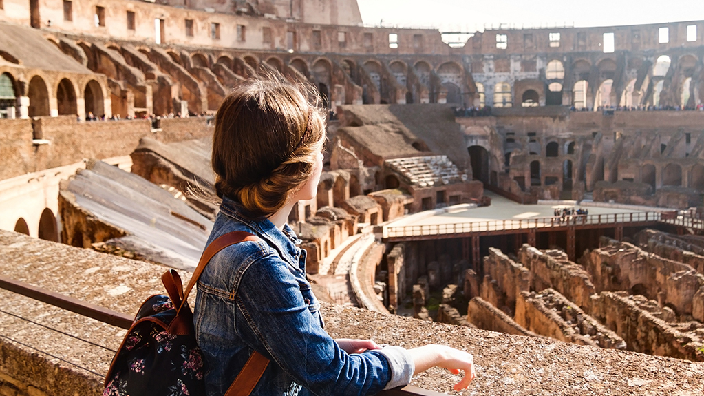 A student exploring inside the Colosseum (Coliseum) in Rome, Italy