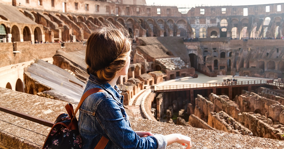 A student exploring inside the Colosseum (Coliseum) in Rome, Italy
