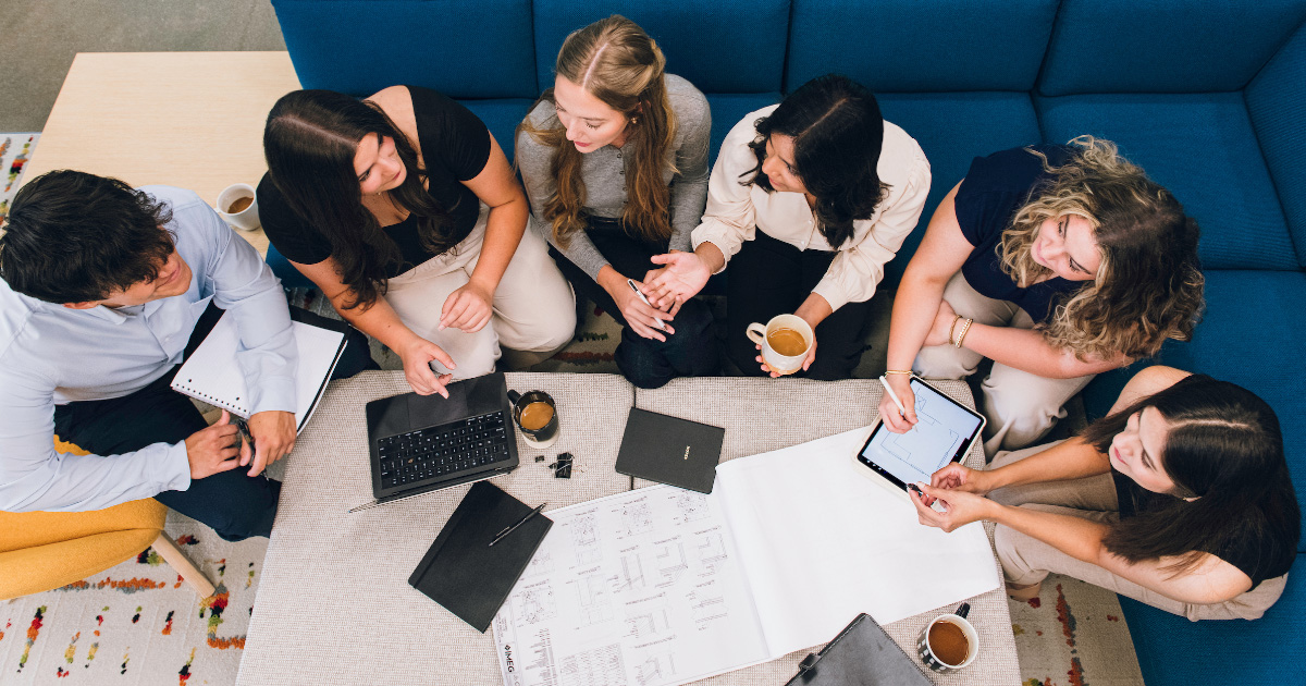 Marketing students working around a table