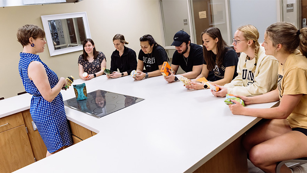 Students listen to a nutrition demonstration
