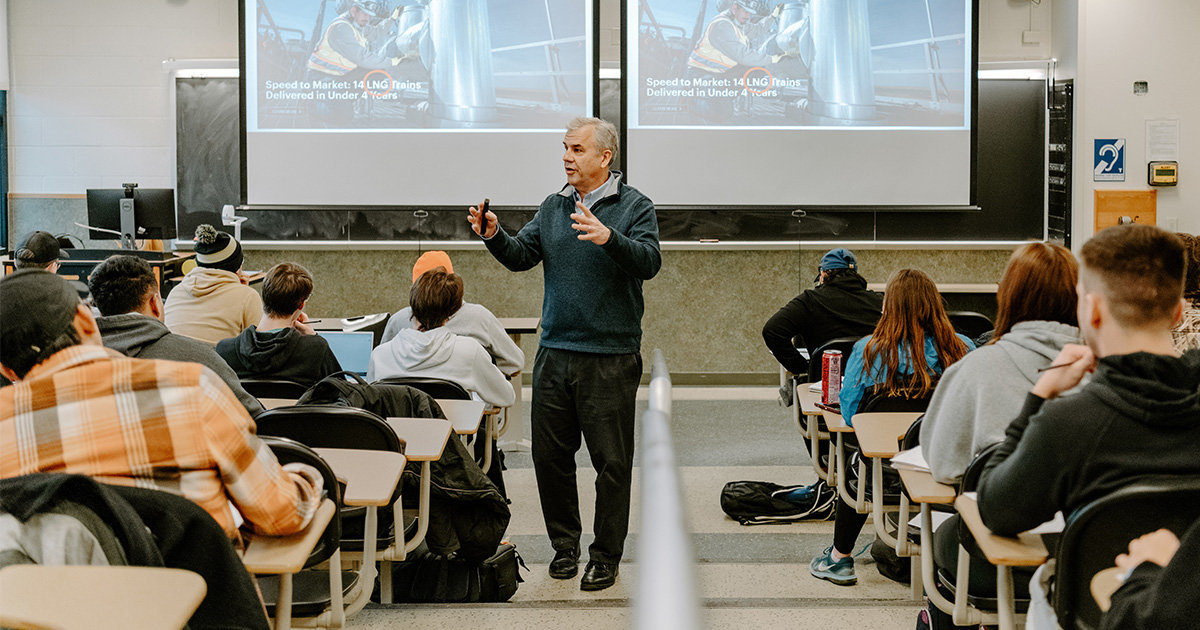 Professor teaching students in auditorium