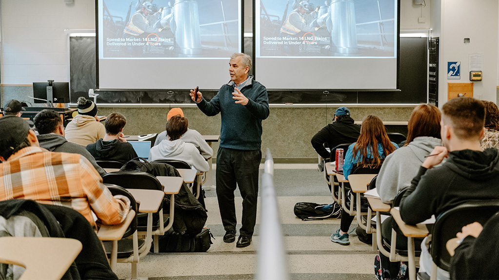 Professor teaching students in auditorium