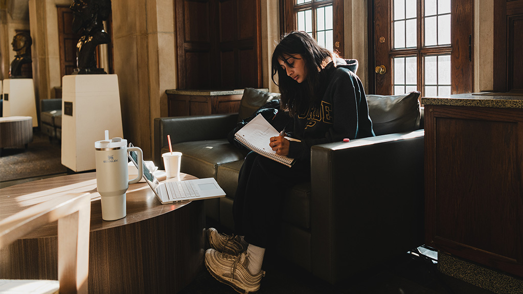 girl doing homework in union building