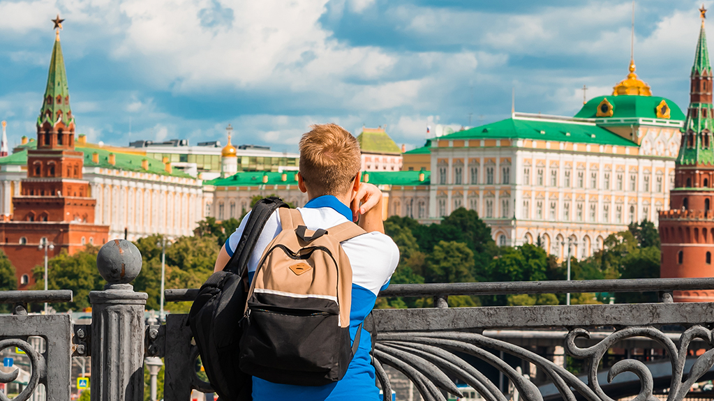 A student looks at the Kremlin in Russia