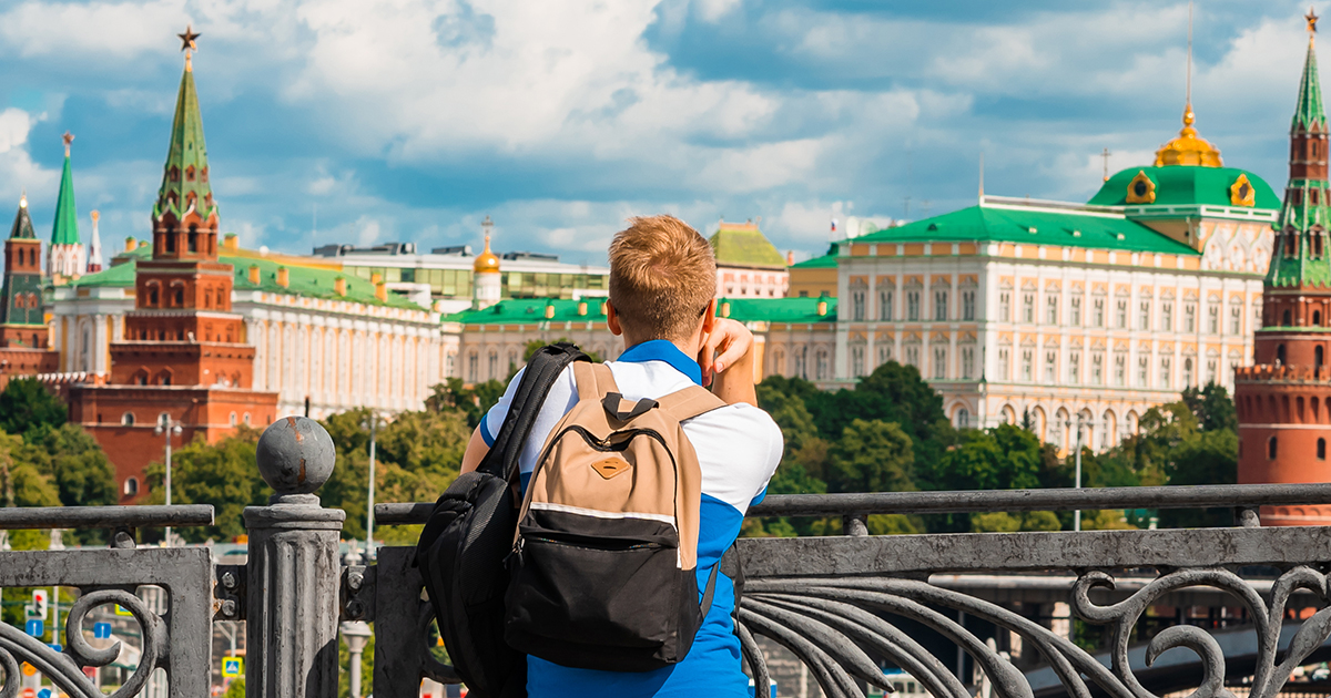 A student looks at the Kremlin in Russia