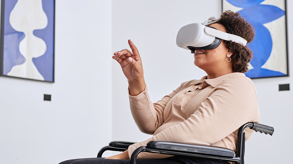 A student uses VR to interact with an art installation