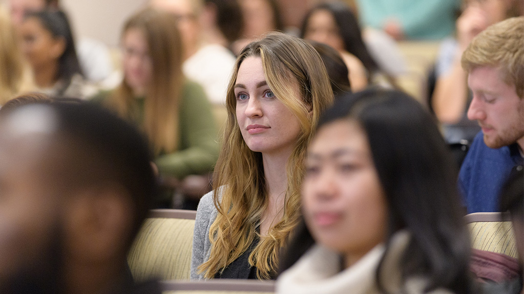student listening in a lecture