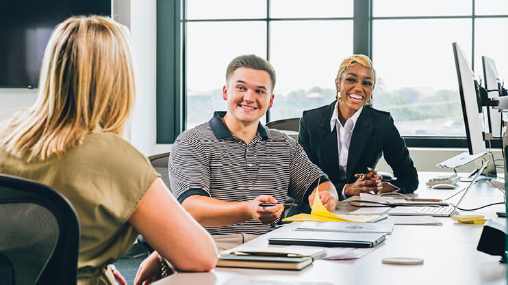 Students working in a professional setting.