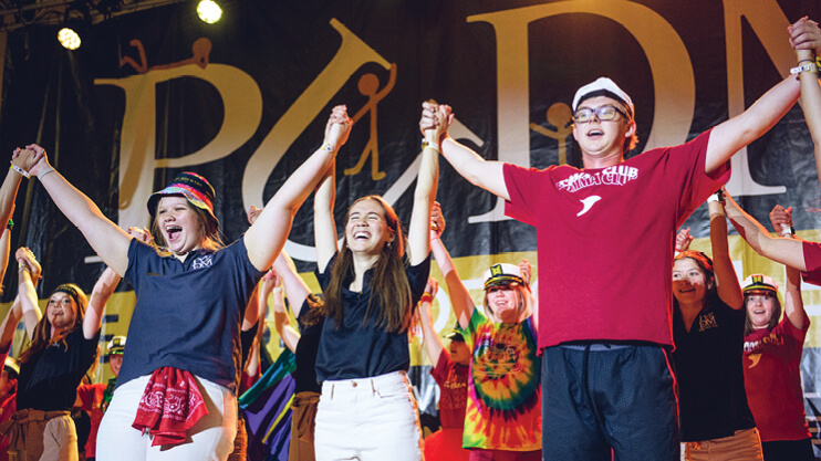 Students performing on stage.