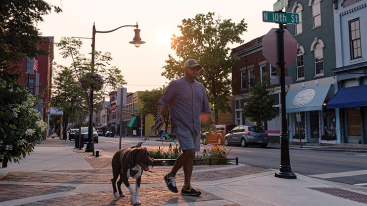 Student walking their dog.