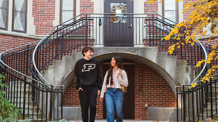 Students in front of building.