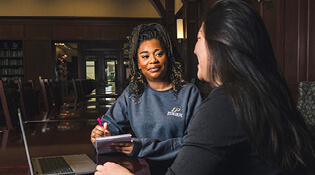 Student and counselor talking.