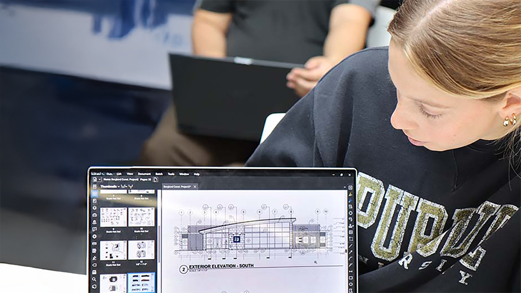 A student studies a building design on a computer