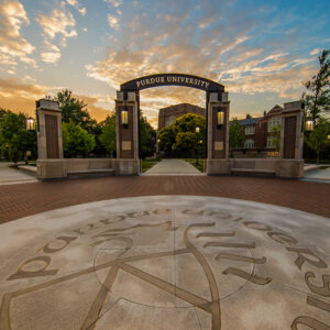 Purdue University arch with sunset in the background