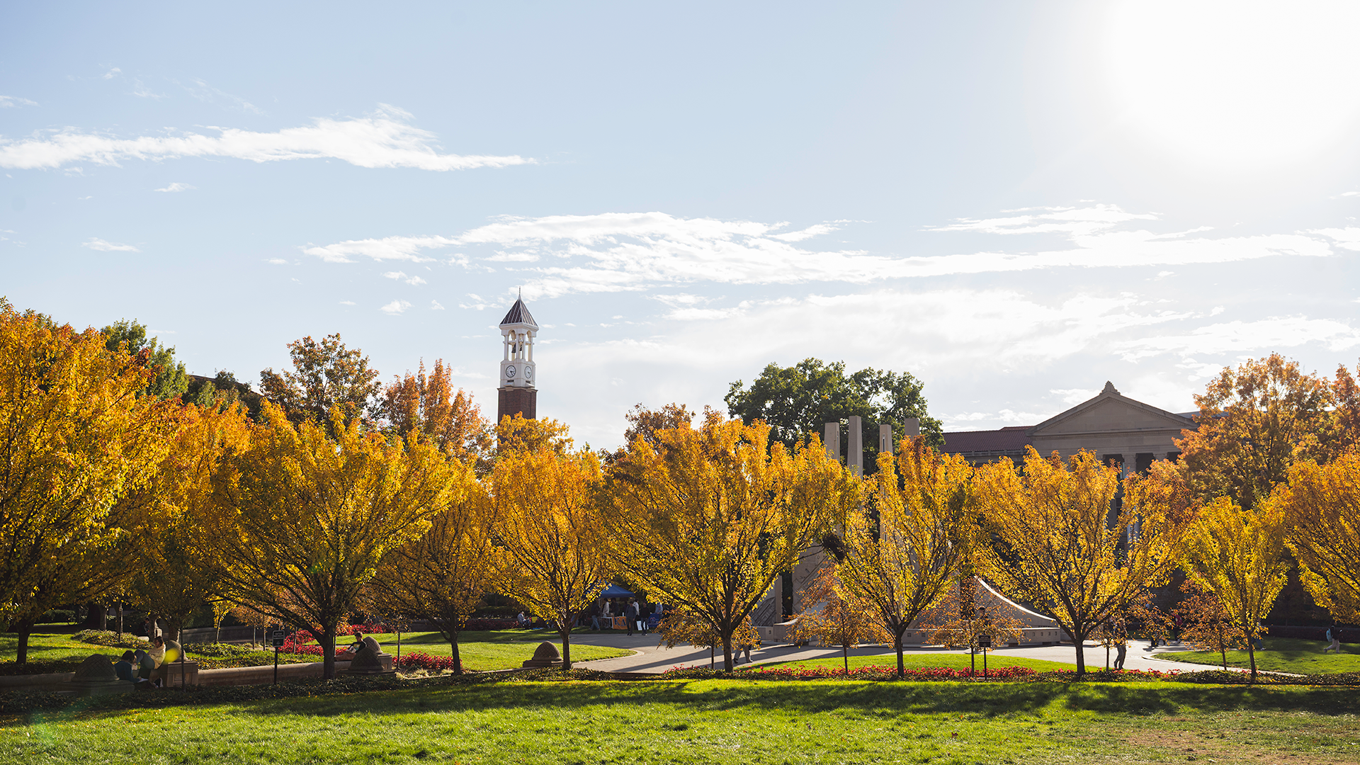 Landscape view of campus with bell tower in the distance during the fall season